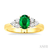 7x5mm Oval Cut Emerald and 1/3 Ctw Round Cut Diamond Ring in 14K Yellow Gold