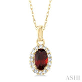 5x3 MM Oval Shape Garnet and 1/20 Ctw Round Cut Diamond Halo Semi-Precious Pendant with Chain in 10K Yellow Gold