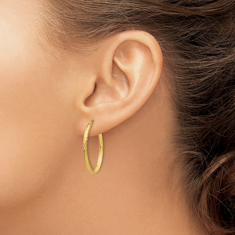 14k 2.5x29mm Lightweight Diamond-cut Oval Tube Hoop Earrings