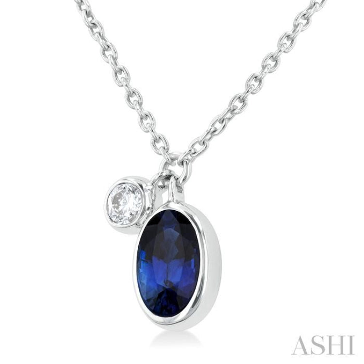 6x4 MM Oval Cut Sapphire and 1/20 Ctw Bezel Set Round Cut Diamond Precious Pendant With Chain in 14K White Gold