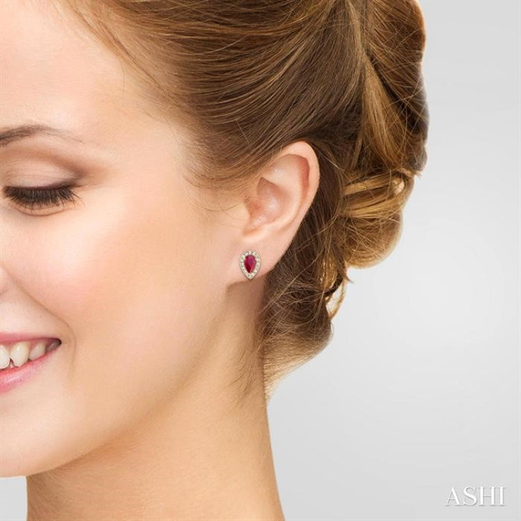 5x3 MM Pear Shape Ruby and 1/8 Ctw Round Cut Diamond Halo Precious Stud Earrings in 10K Yellow Gold