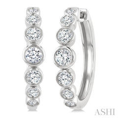 1 1/10 Ctw Graduated Bezel Set Round Cut Diamond Fashion Hoop Earrings in 14K White Gold