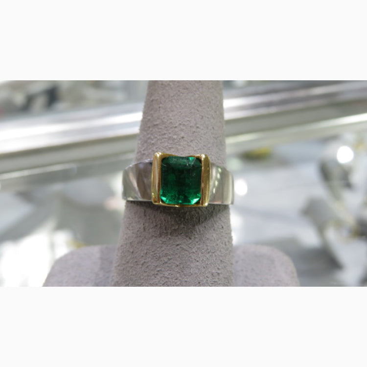 One 18k and platinum ring with emerald cut emerald
