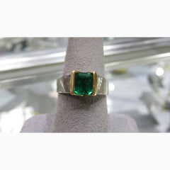 One 18k and platinum ring with emerald cut emerald
