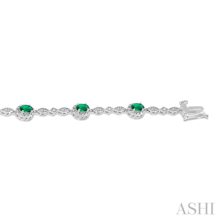 5x3 MM Oval Cut Emerald and 1/20 Ctw Single Cut Diamond Bracelet in 10K White Gold