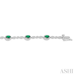 5x3 MM Oval Cut Emerald and 1/20 Ctw Single Cut Diamond Bracelet in 10K White Gold