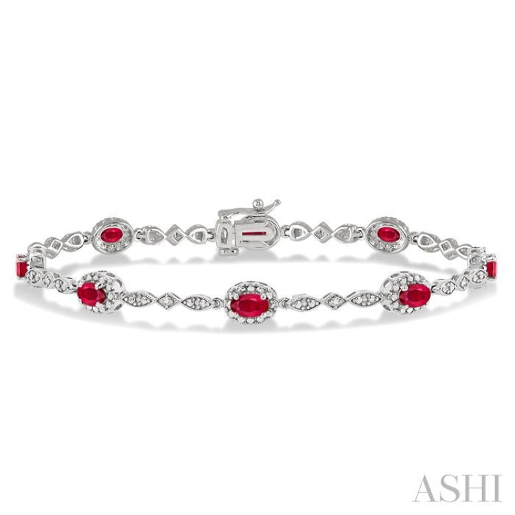 5x3 MM Oval Cut Ruby and 1/20 Ctw Single Cut Diamond Bracelet in 10K White Gold