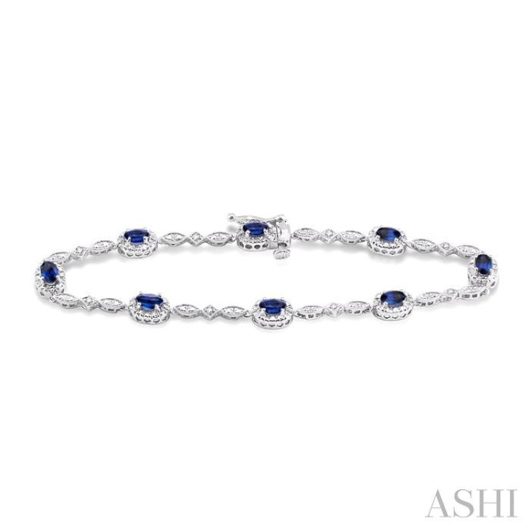 5x3 MM Oval Cut Sapphire and 1/20 ctw Single Cut Diamond Bracelet in 10K White Gold