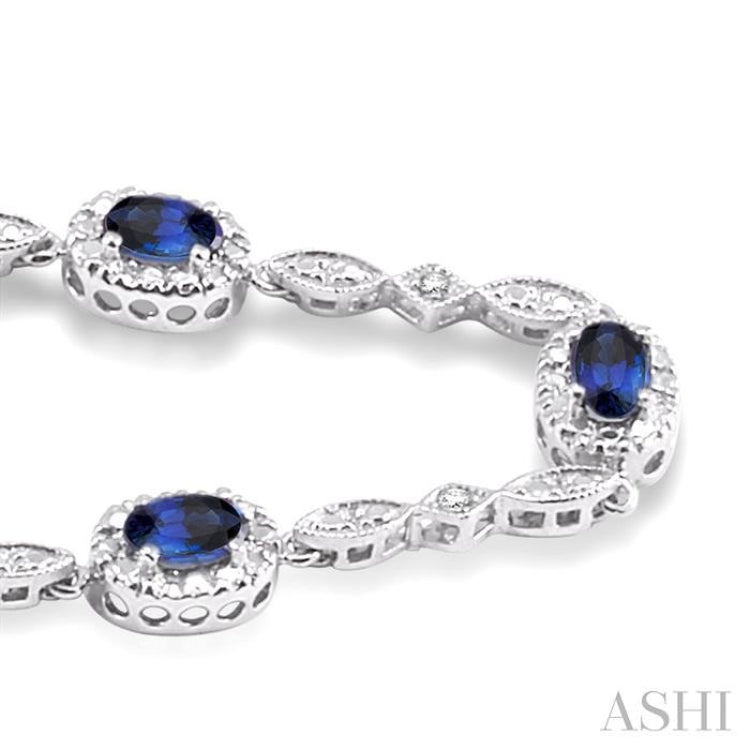 5x3 MM Oval Cut Sapphire and 1/20 ctw Single Cut Diamond Bracelet in 10K White Gold