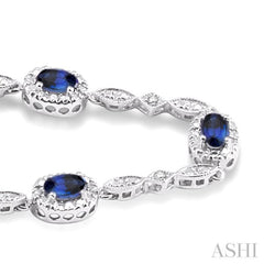 5x3 MM Oval Cut Sapphire and 1/20 Ctw Single Cut Diamond Bracelet in 10K White Gold