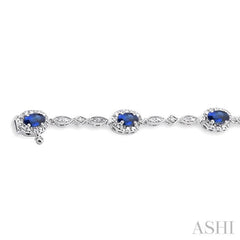 5x3 MM Oval Cut Sapphire and 1/20 ctw Single Cut Diamond Bracelet in 10K White Gold