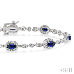 5x3 MM Oval Cut Sapphire and 1/20 ctw Single Cut Diamond Bracelet in 14K White Gold