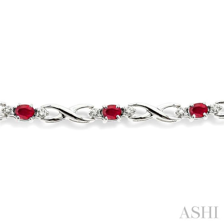 4x3 MM Oval Cut Ruby and 1/10 Ctw Round Cut Diamond Bracelet in 10K White Gold