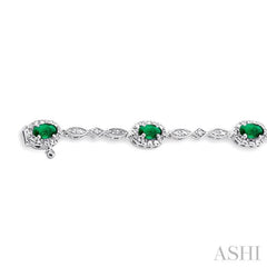 5x3 MM Oval Cut Emerald and 1/20 Ctw Single Cut Diamond Bracelet in 14K White Gold