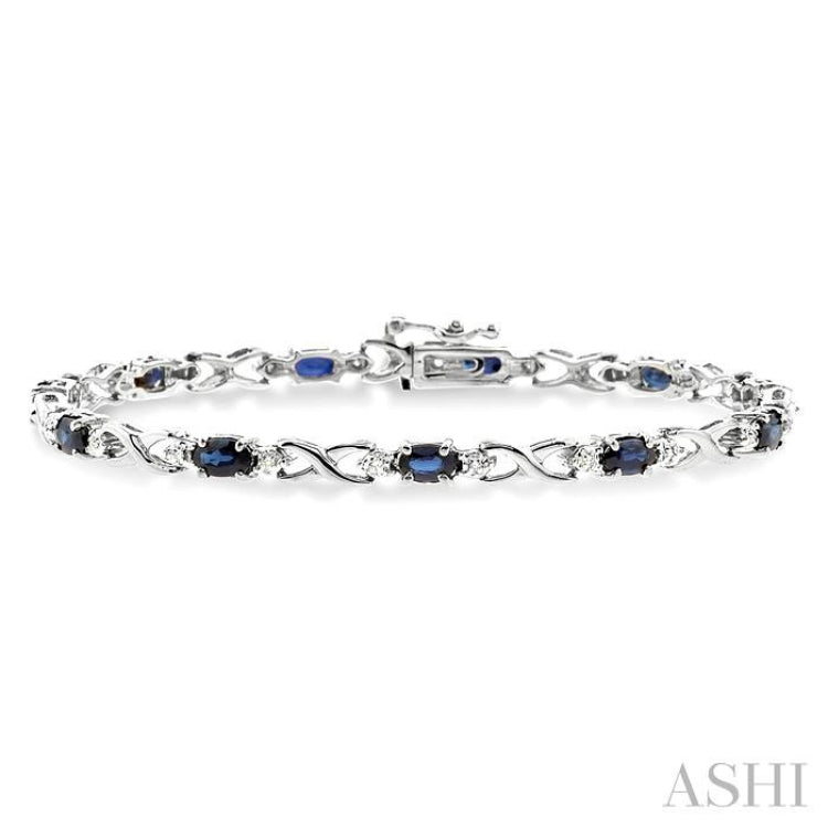 5x3 MM Oval Cut Sapphire and 1/10 ctw Single Cut Diamond Bracelet in 10K White Gold