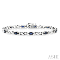 5x3 MM Oval Cut Sapphire and 1/10 ctw Single Cut Diamond Bracelet in 10K White Gold