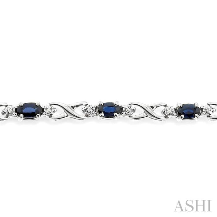 5x3 MM Oval Cut Sapphire and 1/10 ctw Single Cut Diamond Bracelet in 10K White Gold