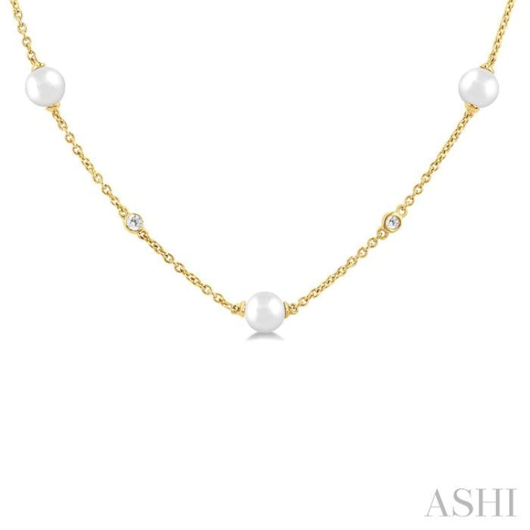 1/8 Ctw 3 MM Cultured Pearl and Round Cut Diamond Station Necklace in 14K Yellow Gold