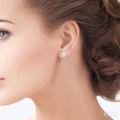 1/5 Ctw Petite Bezel Set Oval Cut Diamond Fashion Stud Earrings in 10K White Gold