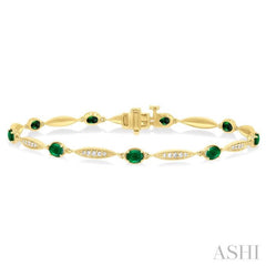 1/4 ctw Oval Cut 4X3 MM Emerald and Round Cut Diamond Precious Bracelet in 10K Yellow Gold