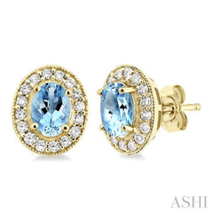 7x5 MM Oval Cut Aquamarine and 3/8 Ctw Round Cut Diamond Earrings in 14K Yellow Gold