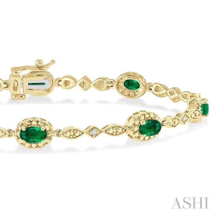 5x3 MM Oval Cut Emerald and 1/20 Ctw Round Cut Diamond Bracelet in 10K Yellow Gold